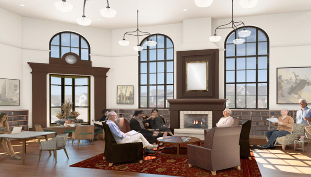 Project image of what the lounge will look like when complete including comfortable chairs and a fireplace